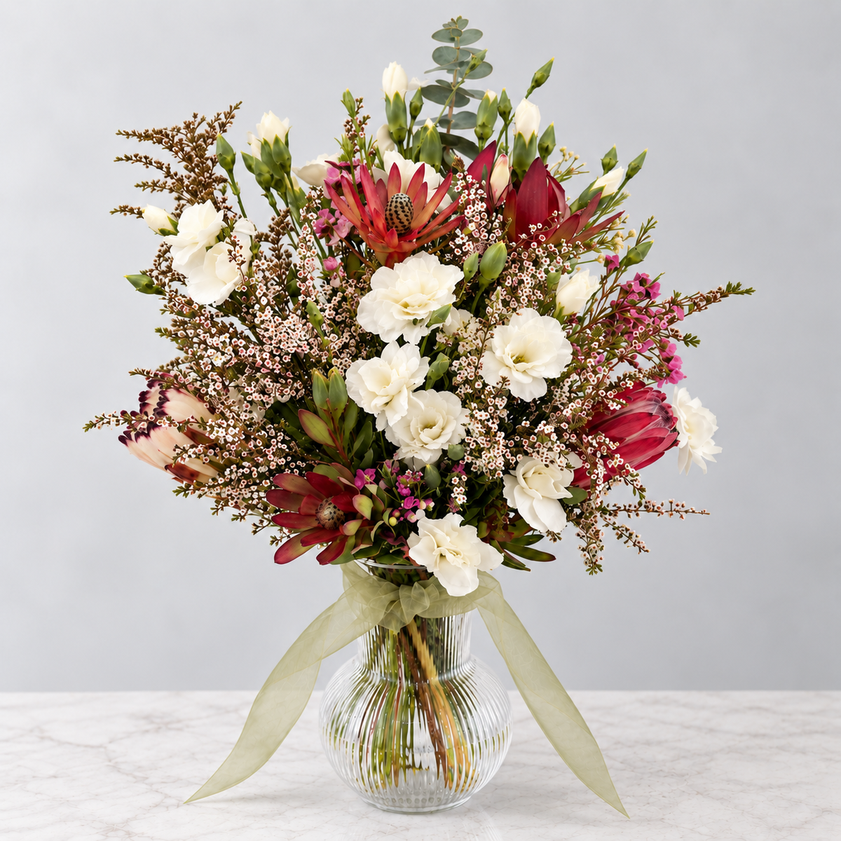Australian natives & soft ivory carnations